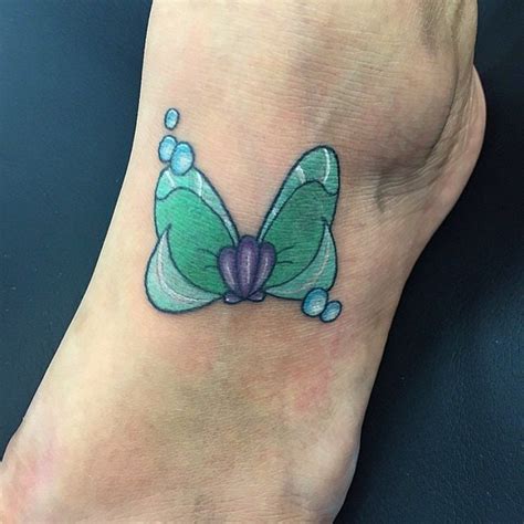 Baby name tattoos family tattoos love tattoos beautiful tattoos tattoos for women tatoos print tattoos disney foot tattoo disney tattoos. Ariel Seashell Bow | These 30 Disney Princess Tattoos Are ...