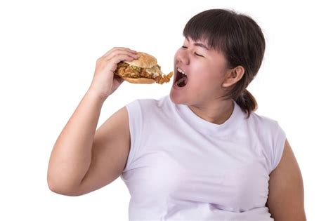 Premium Photo Fat Asian Woman Eating Fried Chicken Hamburger