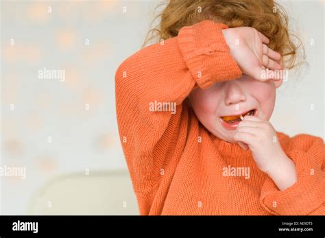 Portrait Of A Little Girl Crying With Arm Over Eyes Stock Photo Alamy