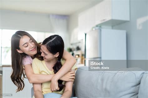 Asian Beautiful Lesbian Women Couple Hugging Girlfriend In Living Room Attractive Two Female Gay