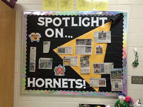 A Bulletin Board With Newspaper Clippings On It That Says Spotlight On