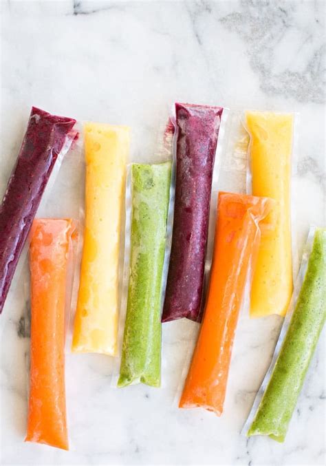 A collection of side by side cooked frozen dinner comparisons where the left is the marketing version of the box and the right is the results of following the microwave cooking. EASY RAINBOW FRUIT AND VEGGIE ICE POPS | Frozen fruit ...