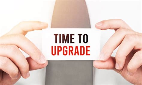 Premium Photo Businessman Holding A Card With Text Time To Upgrade