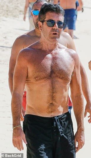 simon cowell 60 displays his slim physique on beach stroll