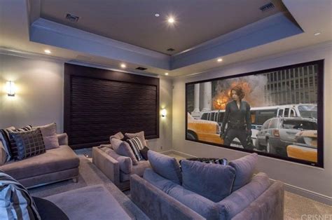The Home Theater Boasts A Set Of Modish Sectional Seats Surrounded By