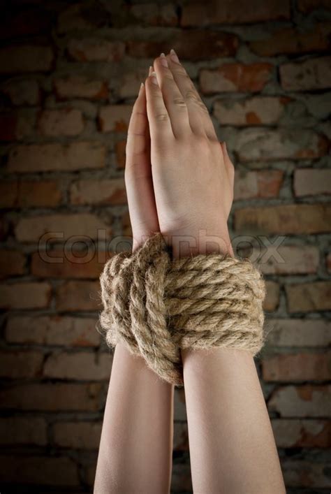 Hands Tied Up With Rope Stock Photo Colourbox