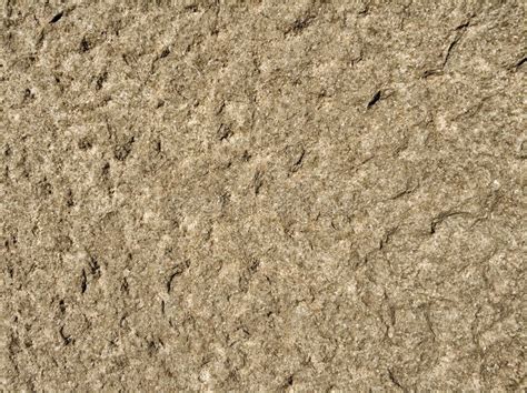 The Beige Colored Wall With The Cracked Stucco Texture Background