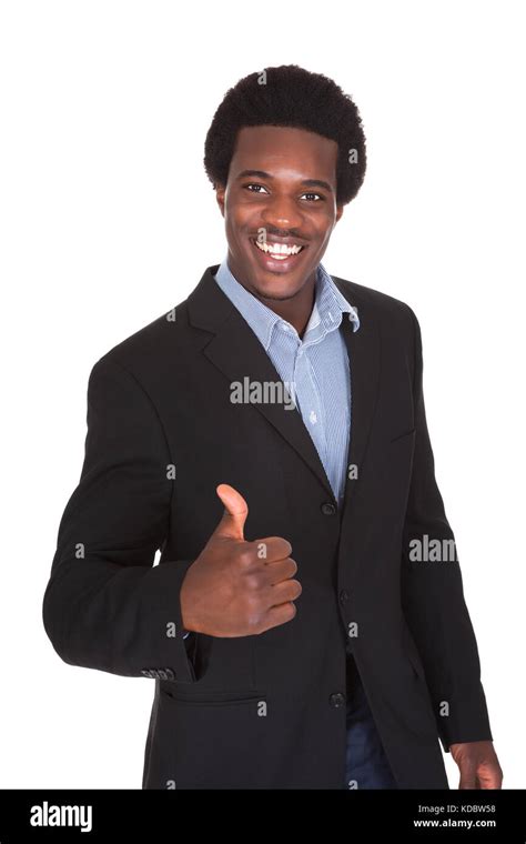 Portrait Of A Young Businessman Showing Thumbs Up Sign Stock Photo Alamy