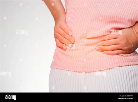 Back View Of Woman Suffering From Backache Waist Pain Muscle Or