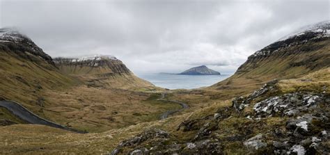 Overcast Landscape View Of Rocky Hillside Valley And Peaks On The Faroe
