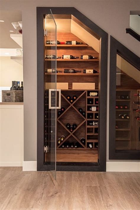 Basement wine room features a wood plank cieling over stone walls fitted with arched wine racks. 9 Decorative and Functional Wine Cellar Ideas For Your ...