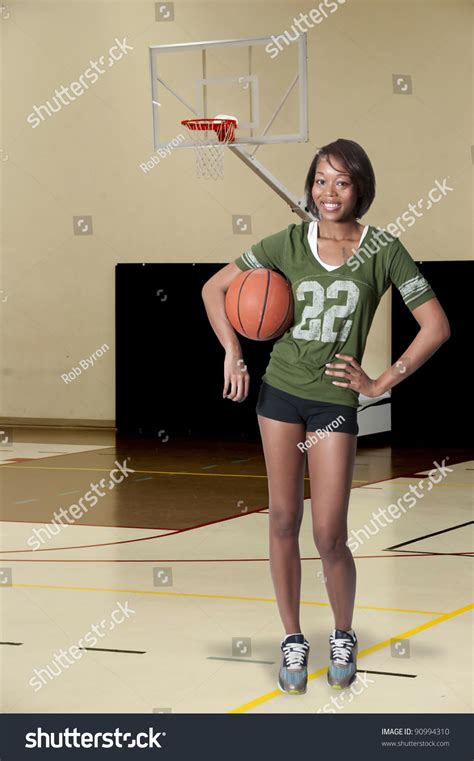 Beautiful Black African American Woman Playing A Game Of Basketball