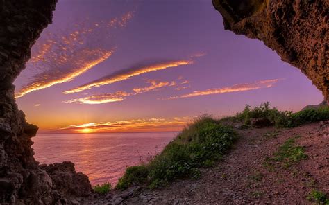 Magnificent Sunset Through A Coastal Cave Hd Wallpaper