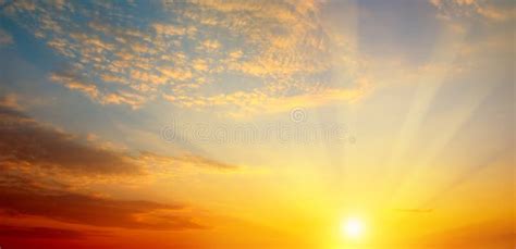 Cloudy Sky And Bright Sun Rise Over The Horizon Wide Photo Stock
