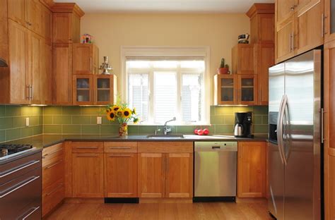 Birch kitchen cabinets not only stand up well to bumps and scrapes, they're considered the least expensive wood cabinet choice. Transitional Red Birch Kitchen