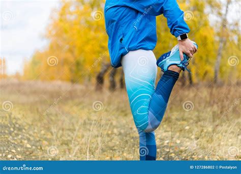 Running Stretching Athlete Woman In Autumn Park Stock Photo Image