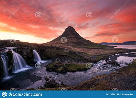 Pink Skies Over The Famous Kirkjufellsfoss Waterfall In The Icelandic