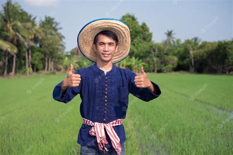 Premium Photo Asian Farmer Man Wear Traditional Costume Standing And