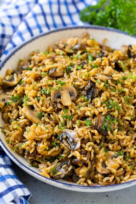A Bowl Of Baked Mushroom Rice Topped With Chopped Parsley Stuffed