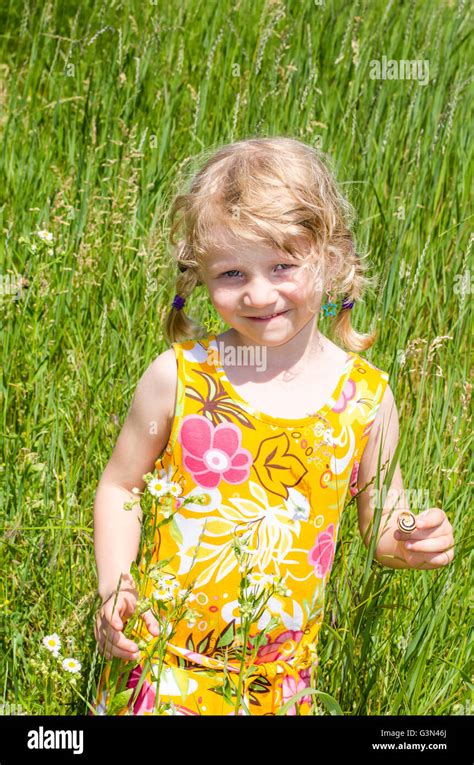 Beautiful Blond Girl On Green Grass Background Stock Photo Alamy