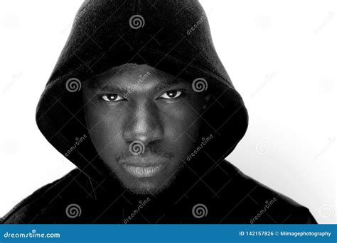 Black And White Portrait Of Young Black Man With Hoodie Stock Photo