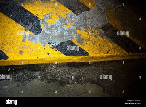 Black And Yellow Striped Curb Stock Photo Alamy