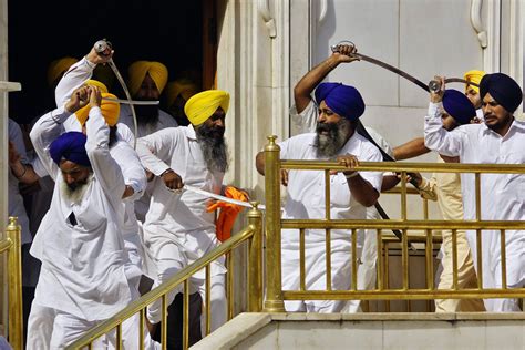 Sikhs Wield Swords During Their Clash The Golden Temple Mirror Online
