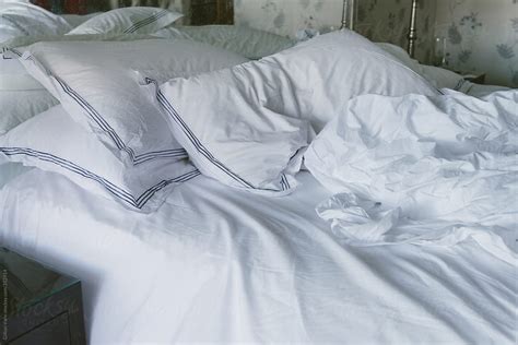 Unmade Bed With White Sheets By Gillian Vann