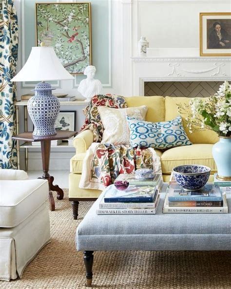 The Living Room Is Decorated With Blue And White Decor Including A