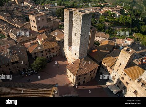 medieval towers from xiii century torre chigi and casa torre pesciolini on piazza dell`erbe in