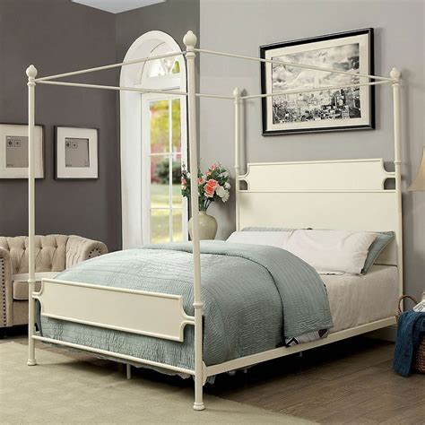 This iron canopy bed features a gorgeous white headboard and elegant white bedding. Beatrix Metal Canopy Bed (White) by Furniture of America ...