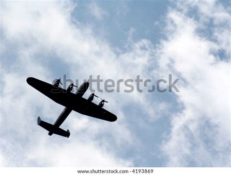 Silhouette Lancaster Bomber Against Blue Sky Stock Photo 4193869