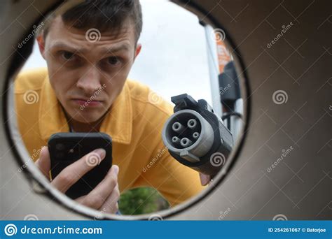 Man Charging His Electric Vehicle Stock Image Image Of Volts