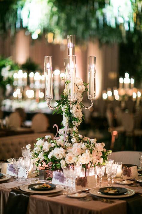 Rounds Tables With Crystal Candelabras Draped In Florals By Layers