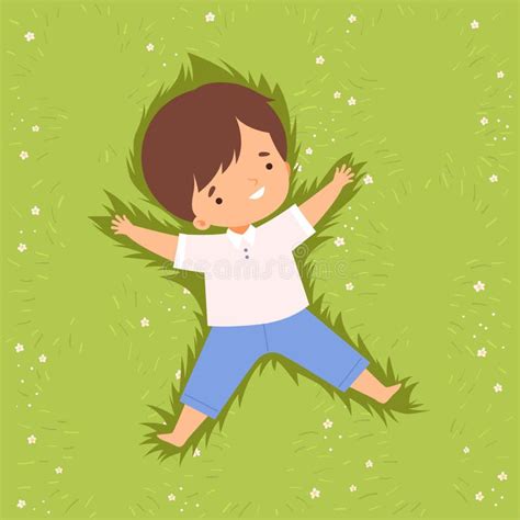 Cute Happy Boy Lying Down On Green Lawn Adorable Kid Having Fun