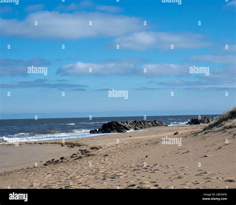 Far Away Beach Rocks Stock Photo Alamy