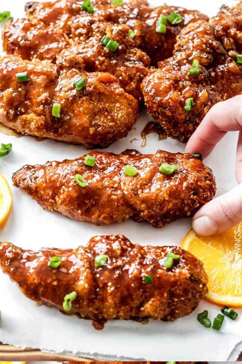 Toss chicken tenders in melted butter until well. Sweet and Spicy Baked Orange Chicken Tenders - Carlsbad ...