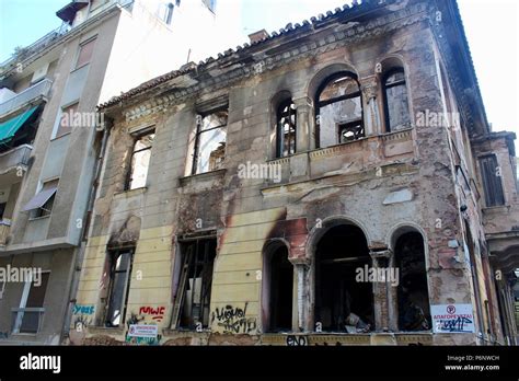 burnt out abandoned building in athens greece Stock Photo - Alamy