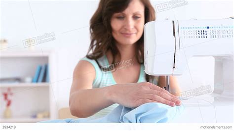 Brunette Woman Using A Sewing Machine Stock Video Footage 3934219