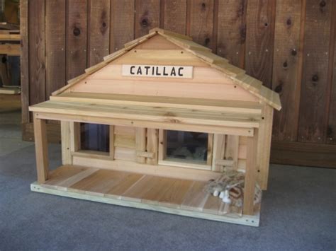 Purchase a large plastic storage container and a slightly smaller one. Catillac Cats House