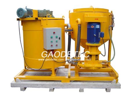 Shown are a ready mix truck and a masonry grout pump. grout mixing machine