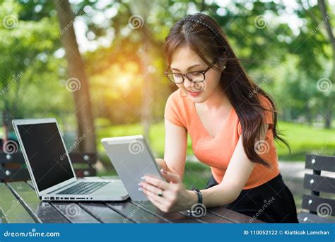 Young Girl Using Tablet And Laptop Computer Stock Photo Image Of