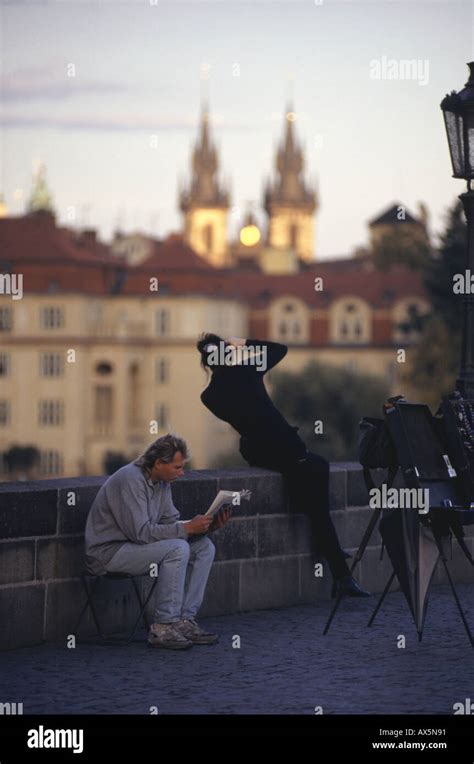 Prague Czech Republic Woman In Black Taking A Picture Of The Charles