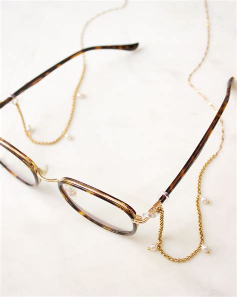 brenda glasses chain is a gold stainless steel chain with delicate freshwater pearls glasses