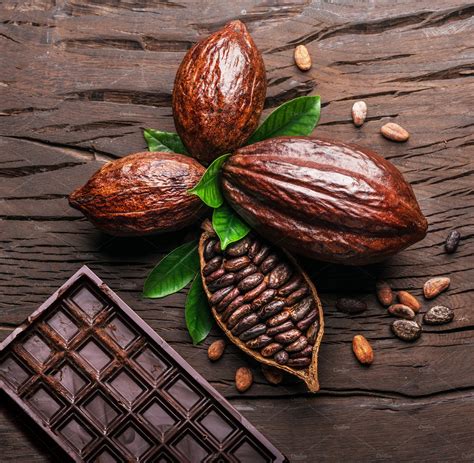 cocoa pod cocoa beans and chocolate featuring background bar of chocolate high quality food