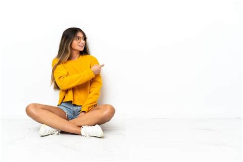 Premium Photo Young Woman Sitting On The Floor Isolated