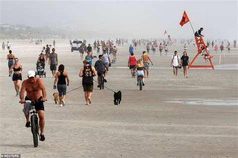 Residents Flock To Florida S Cocoa Beach As It Reopens For Sun Tanning