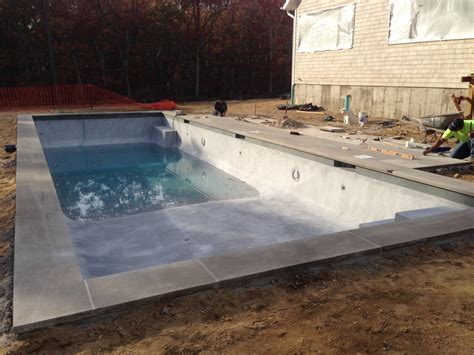 Gunite is the term to mean a mix of dry concrete and shotcrete when dealing with wet concrete. Gunite Pool Atop Concrete Supports in Mattituck - Patricks ...