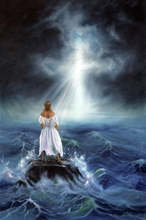 Lady Standing On A Rock In The Middle Of The Ocean Looking On At Cross