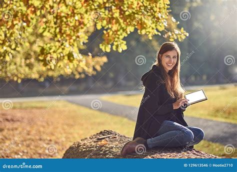 Pretty Young Woman Relaxing In An Autumn Park Stock Photo Image Of